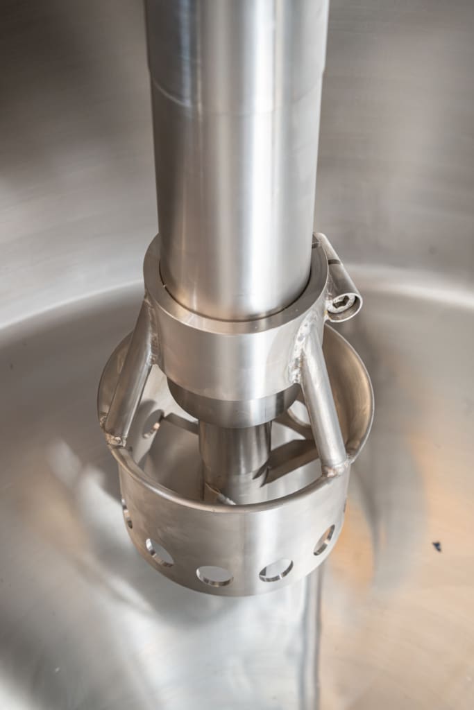 Close-up of stainless steel industrial mixer for confectionery processing